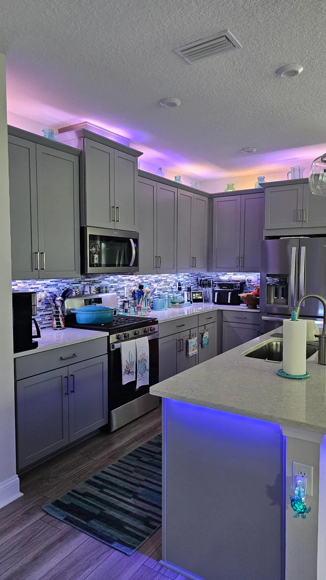 Teal cove light across the kitchen ceiling