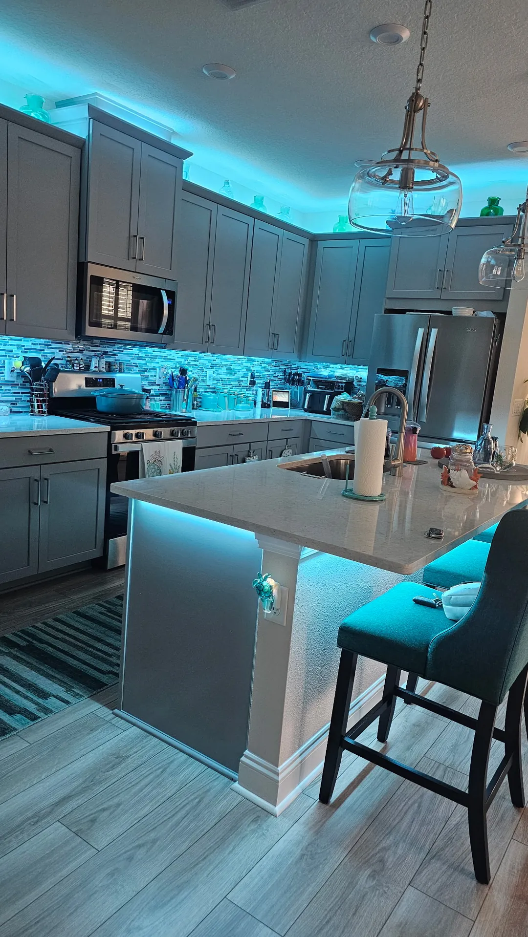 Teal across the kitchen from the seating side